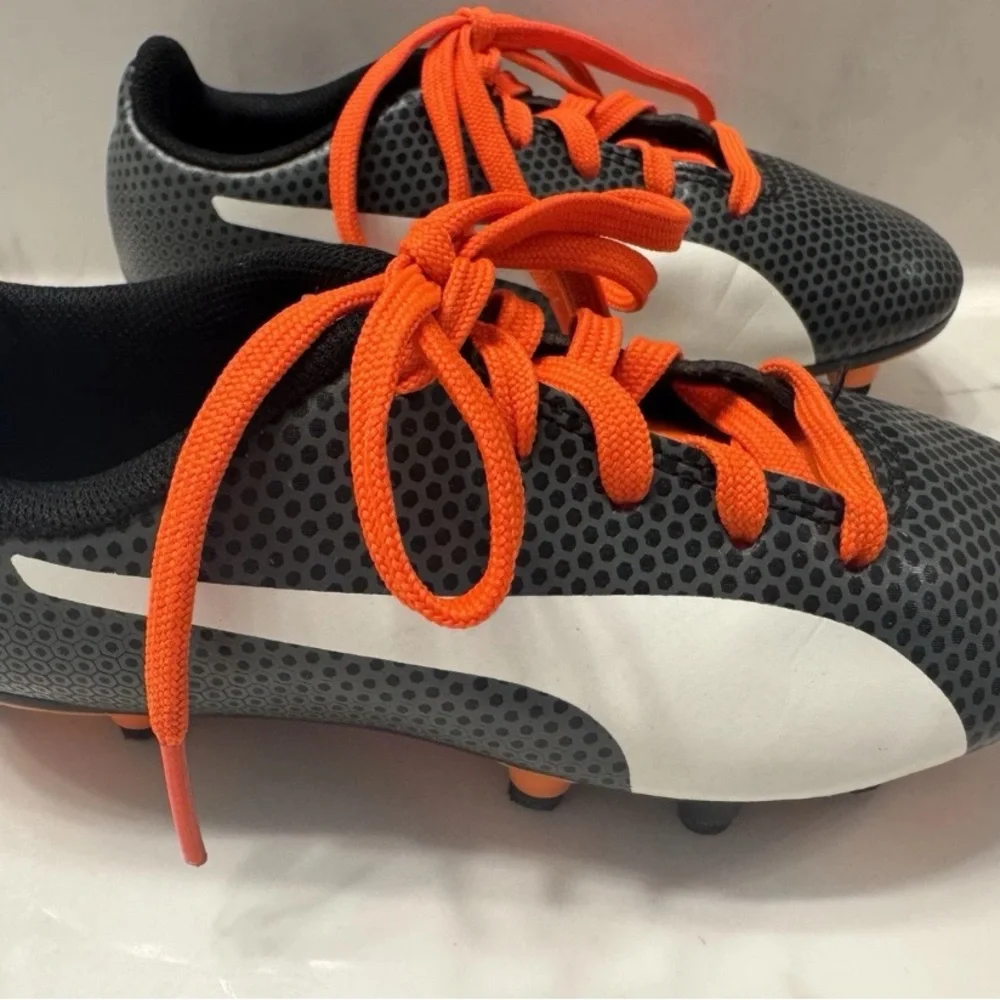PUMA Kid’s Cleats in orange‎ and black
